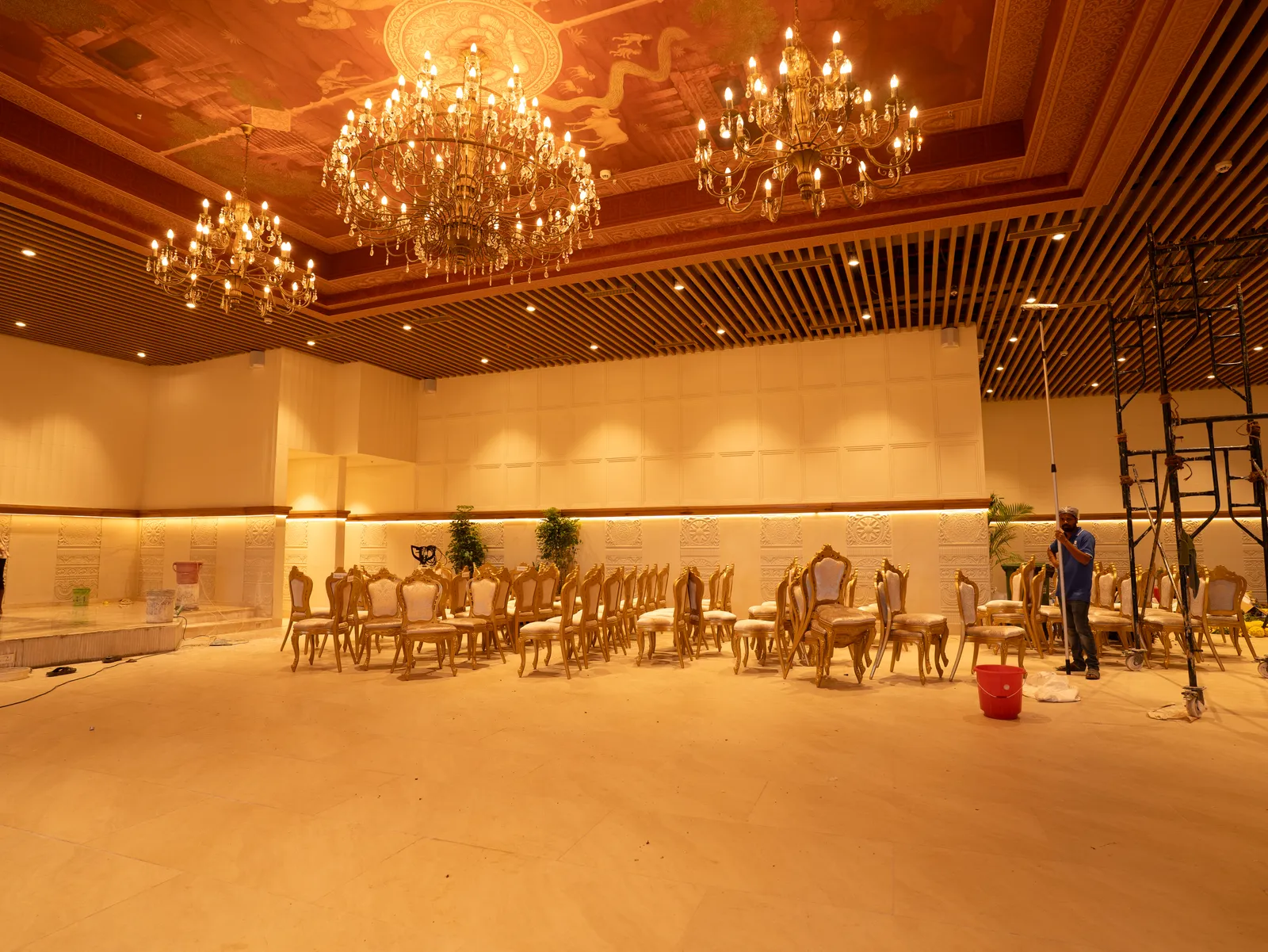 Banquet hall with crystal chandeliers and dining setup — Chalukya Samrat